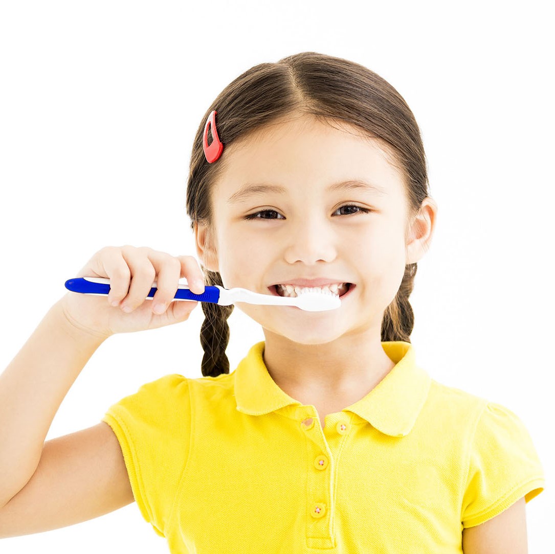 happy Little girl brushing the teeth